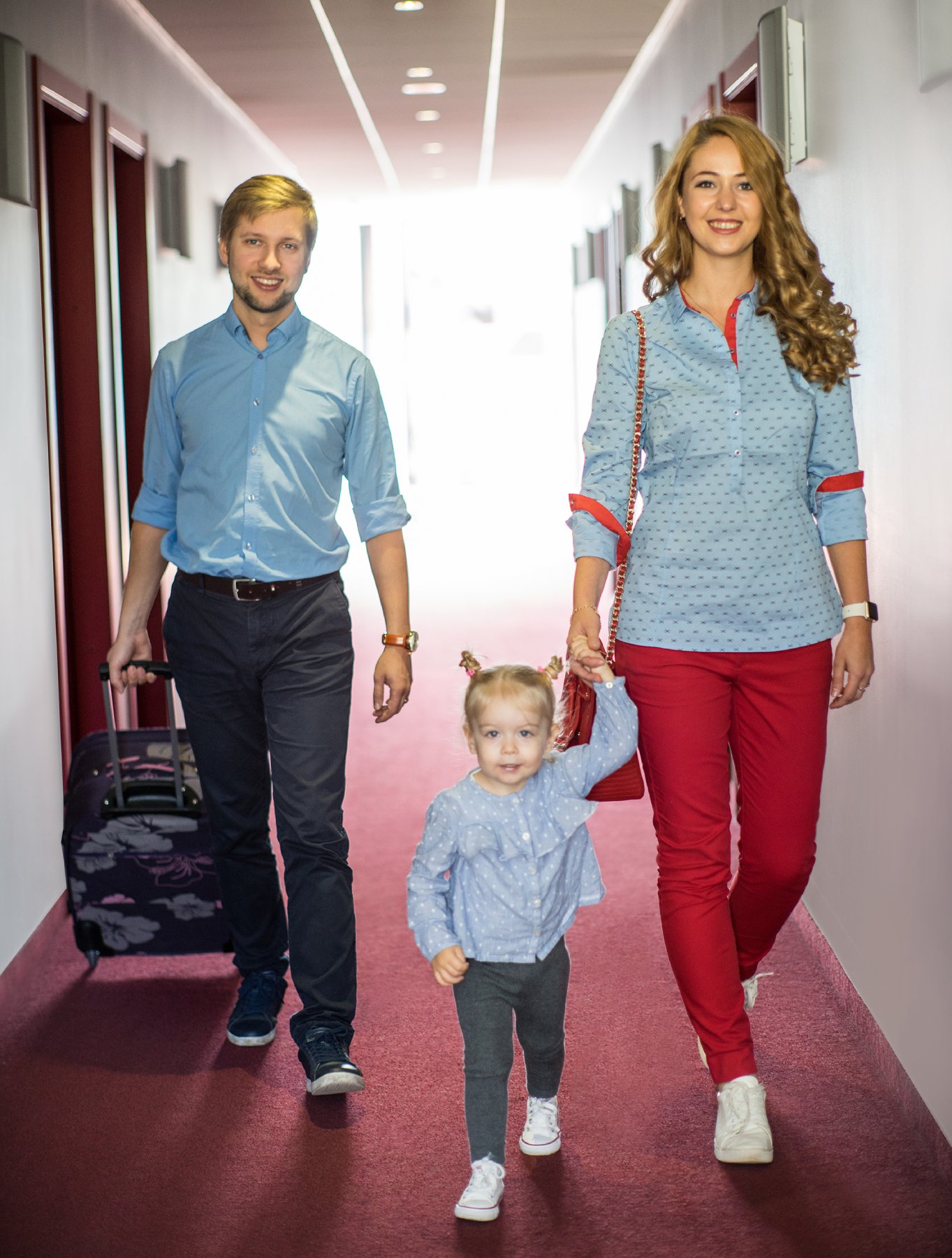 Hotel corridor with family